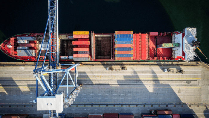 An aerial top view of a maritime container terminal