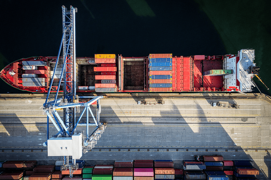 An aerial top view of a maritime container terminal
