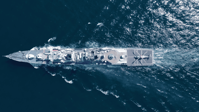A naval operation vessel conducting maritime patrol maneuvers