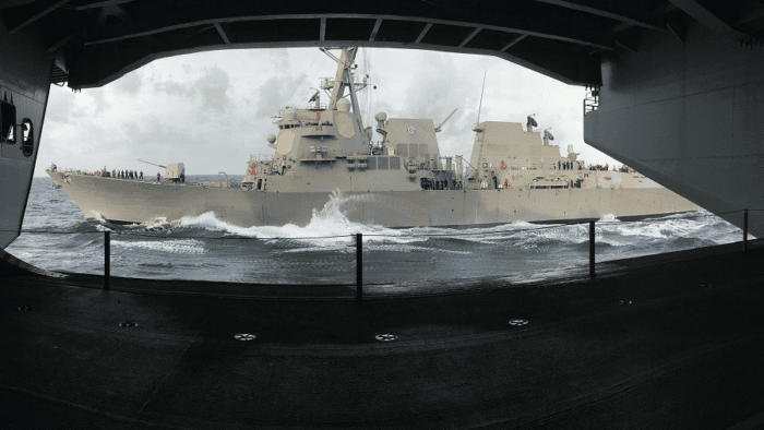 A naval operations group conducting maritime patrol maneuvers