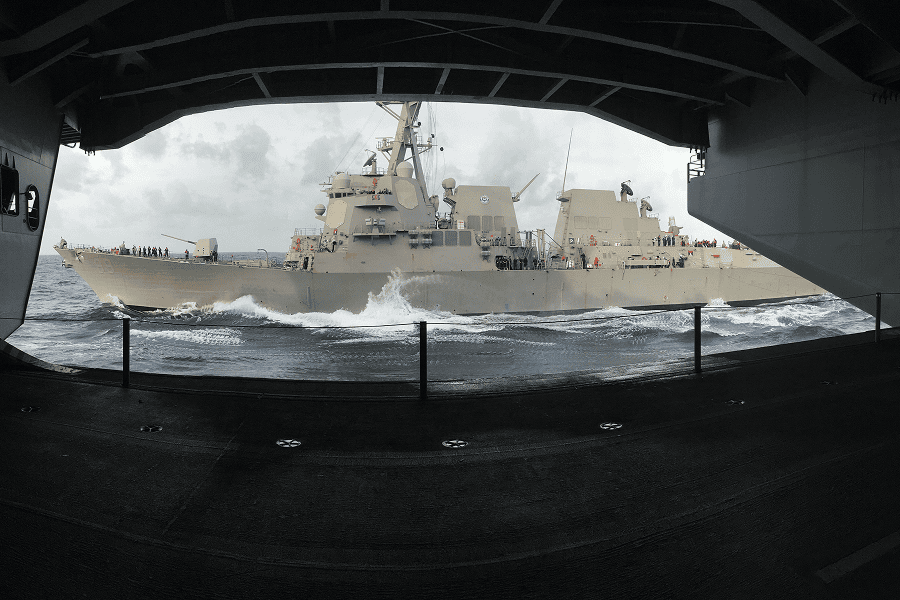 A naval operations group conducting maritime patrol maneuvers