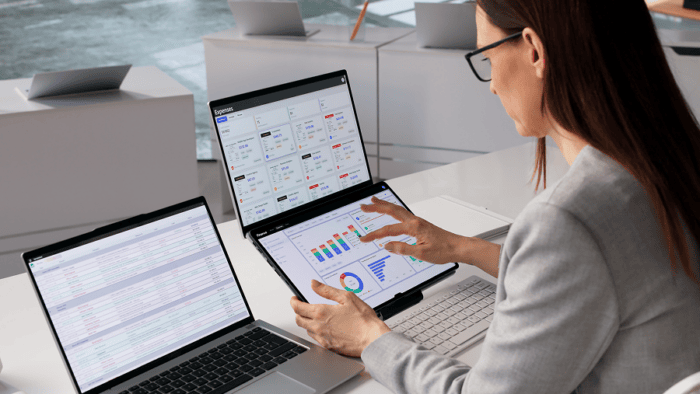 A female analyst reviewing data graphs