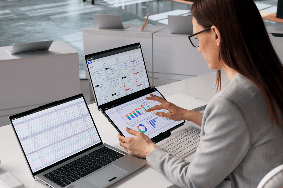 A female analyst reviewing data graphs