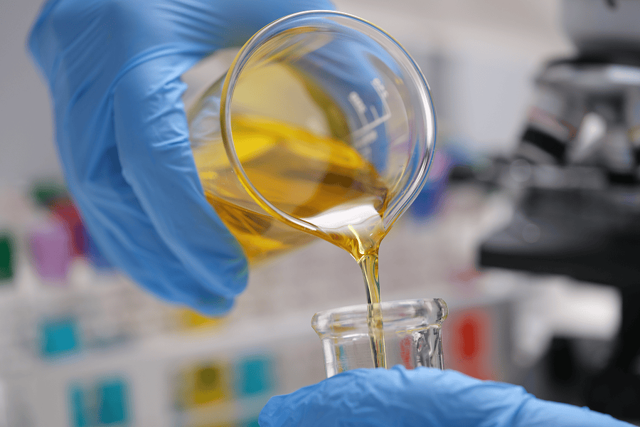 An industrial laboratory technician conducting marine fuel and oil testing