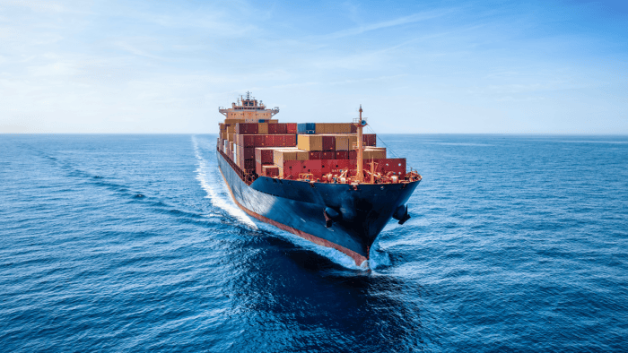 A large cargo vessel navigating open ocean waters
