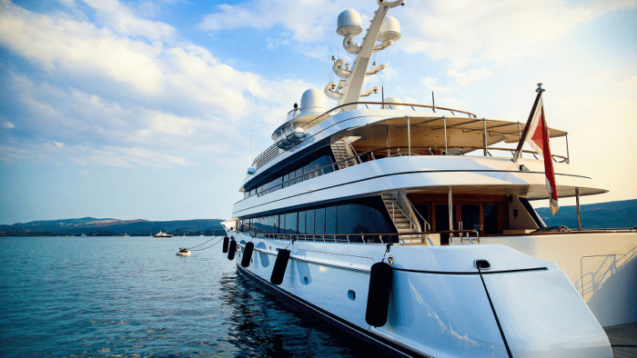 A modern luxury yacht cruising through open sea waters