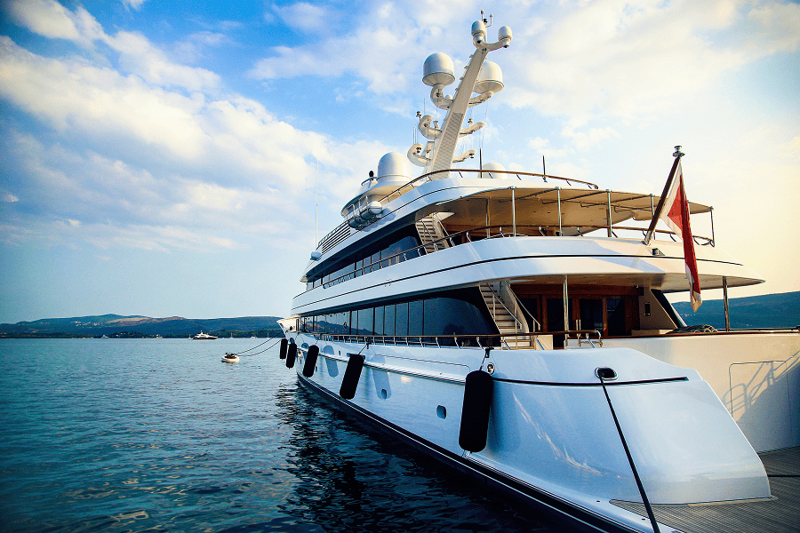 A modern luxury yacht cruising through open sea waters