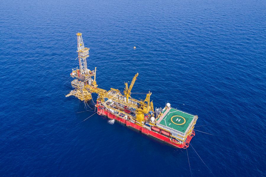An offshore oil rig operating at sea
