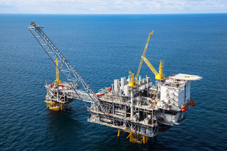 An offshore oil rig operating at sea