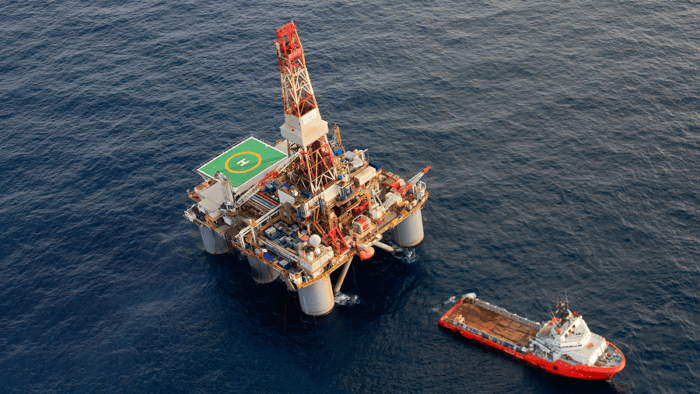 An offshore oil rig operating at sea