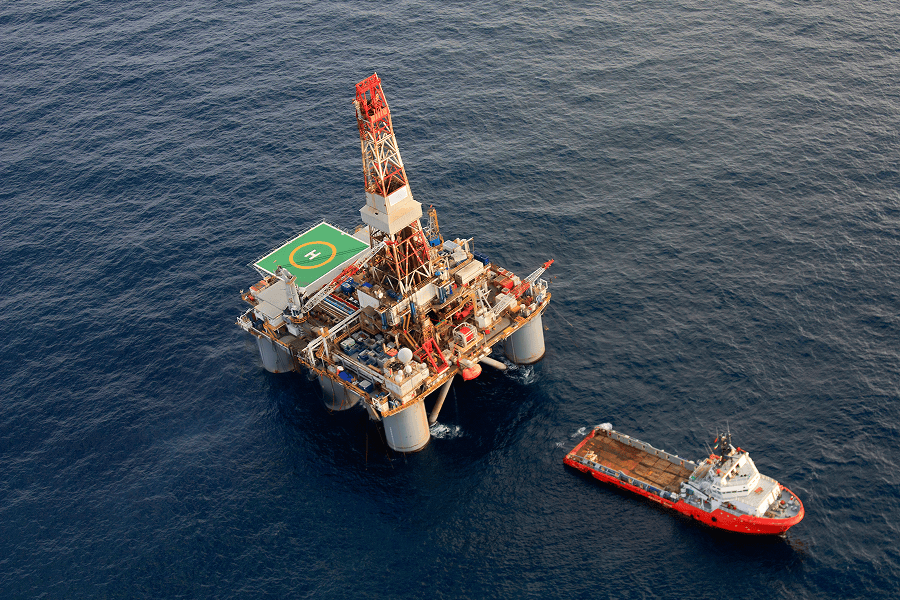 An offshore oil rig operating at sea