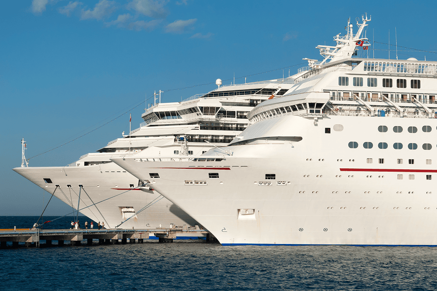 Two large cruise ships docked together