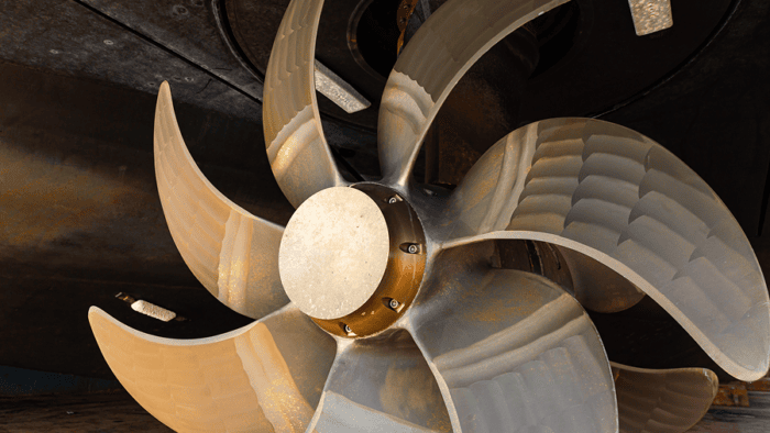 A view of a massive bronze marine propeller