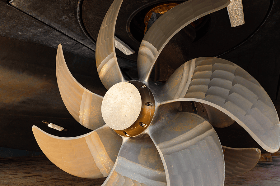A view of a massive bronze marine propeller