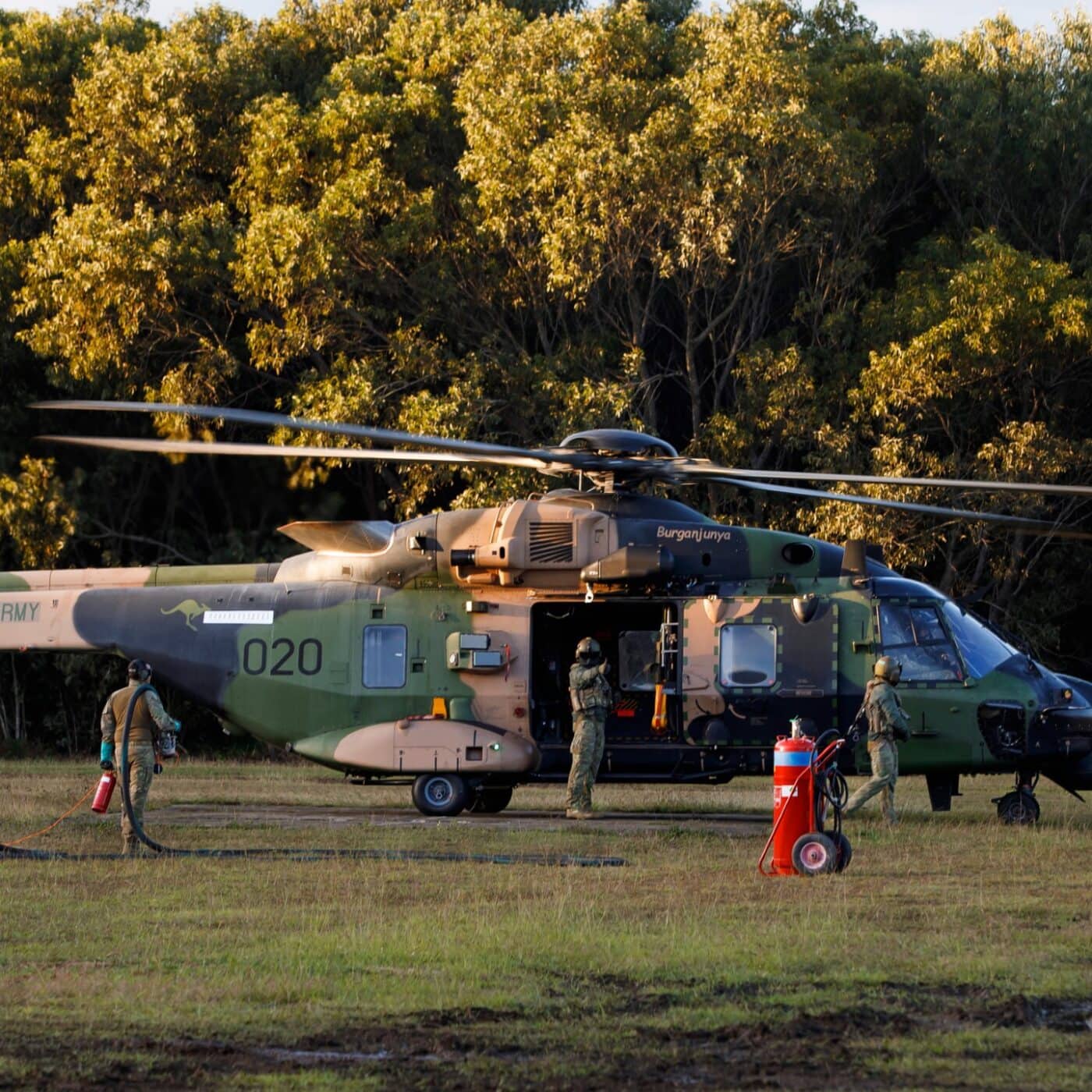 Military refueling operations being conducted on an MRH90 helicopter