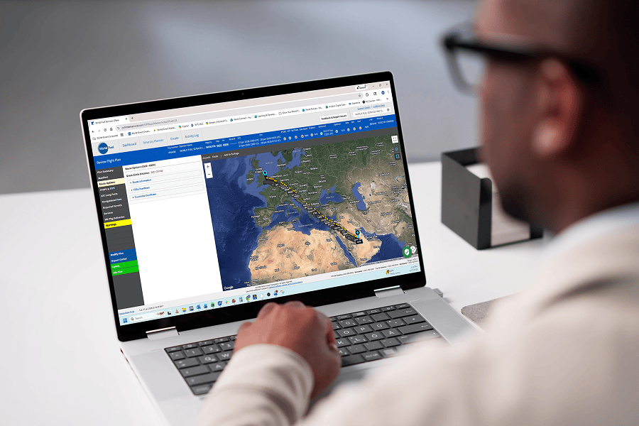 Person using laptop with map displayed