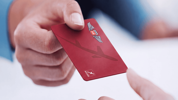 Hand exchanging a red P66 AVCARD.