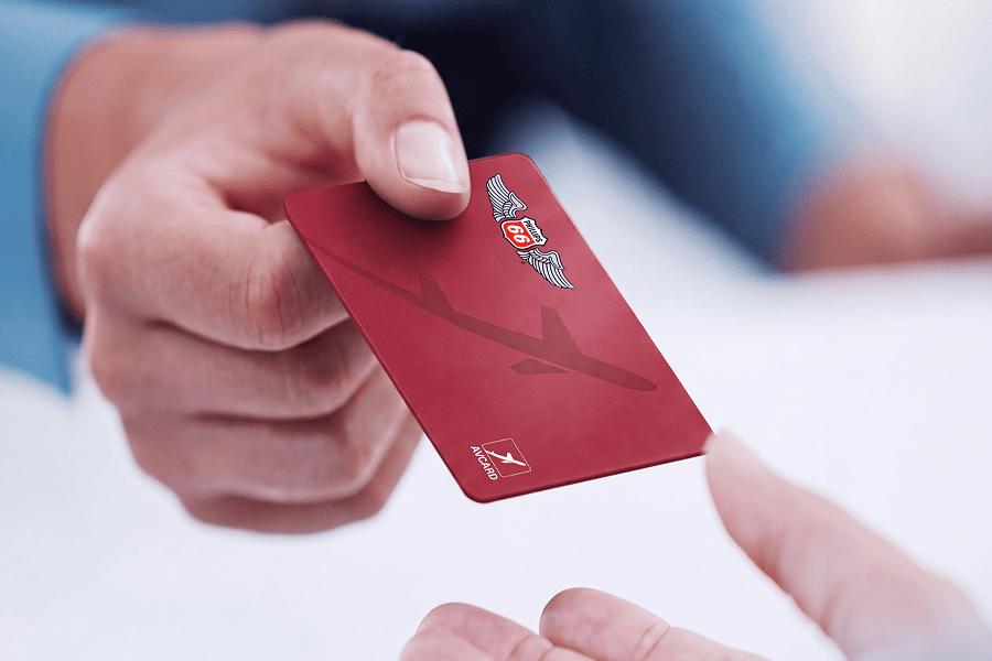 Hand exchanging a red P66 AVCARD.