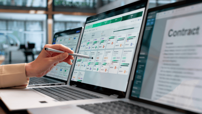 Person reviewing contract management software interface.