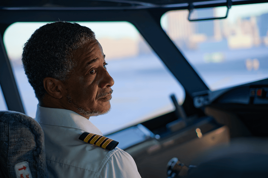 Pilot gazing thoughtfully from cockpit.