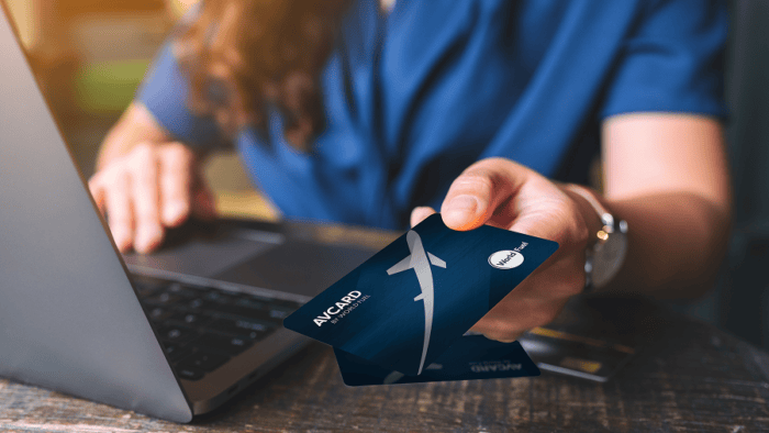 Person using laptop with credit card