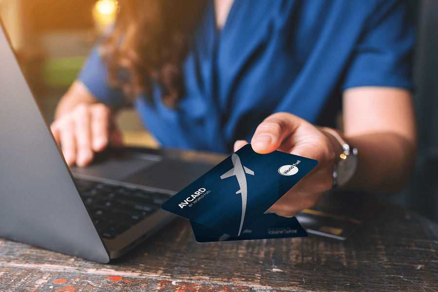 Person using laptop with credit card