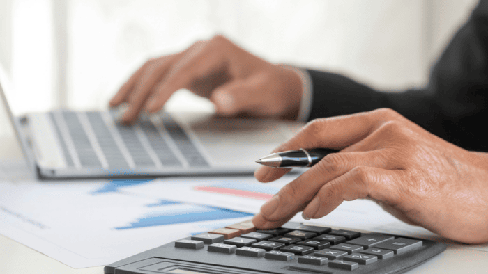 man using calculator
