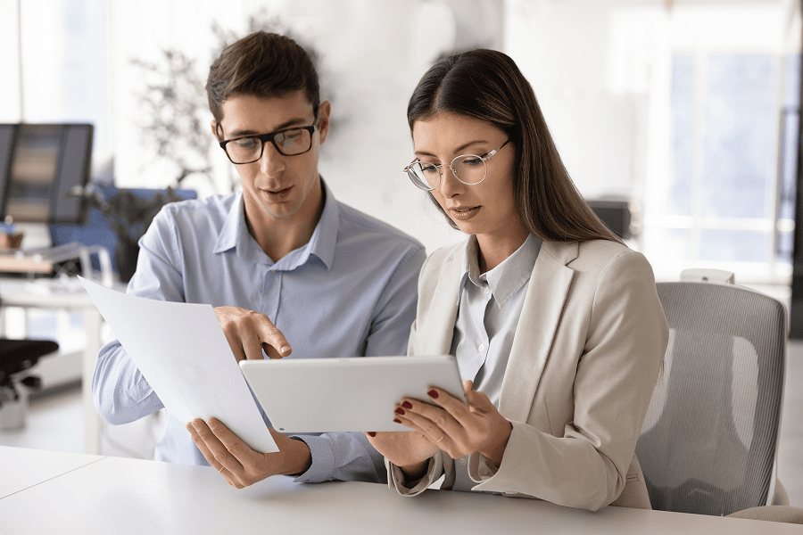 Colleagues reviewing documents together.