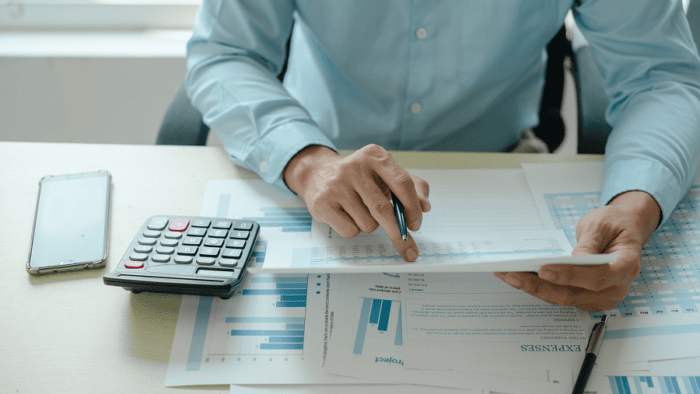 man looking over expenses
