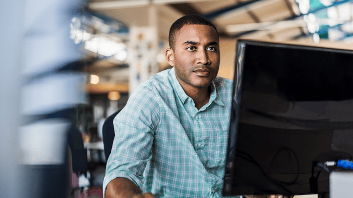 man looking at computer screen