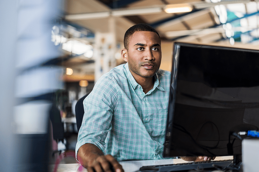 man looking at computer screen