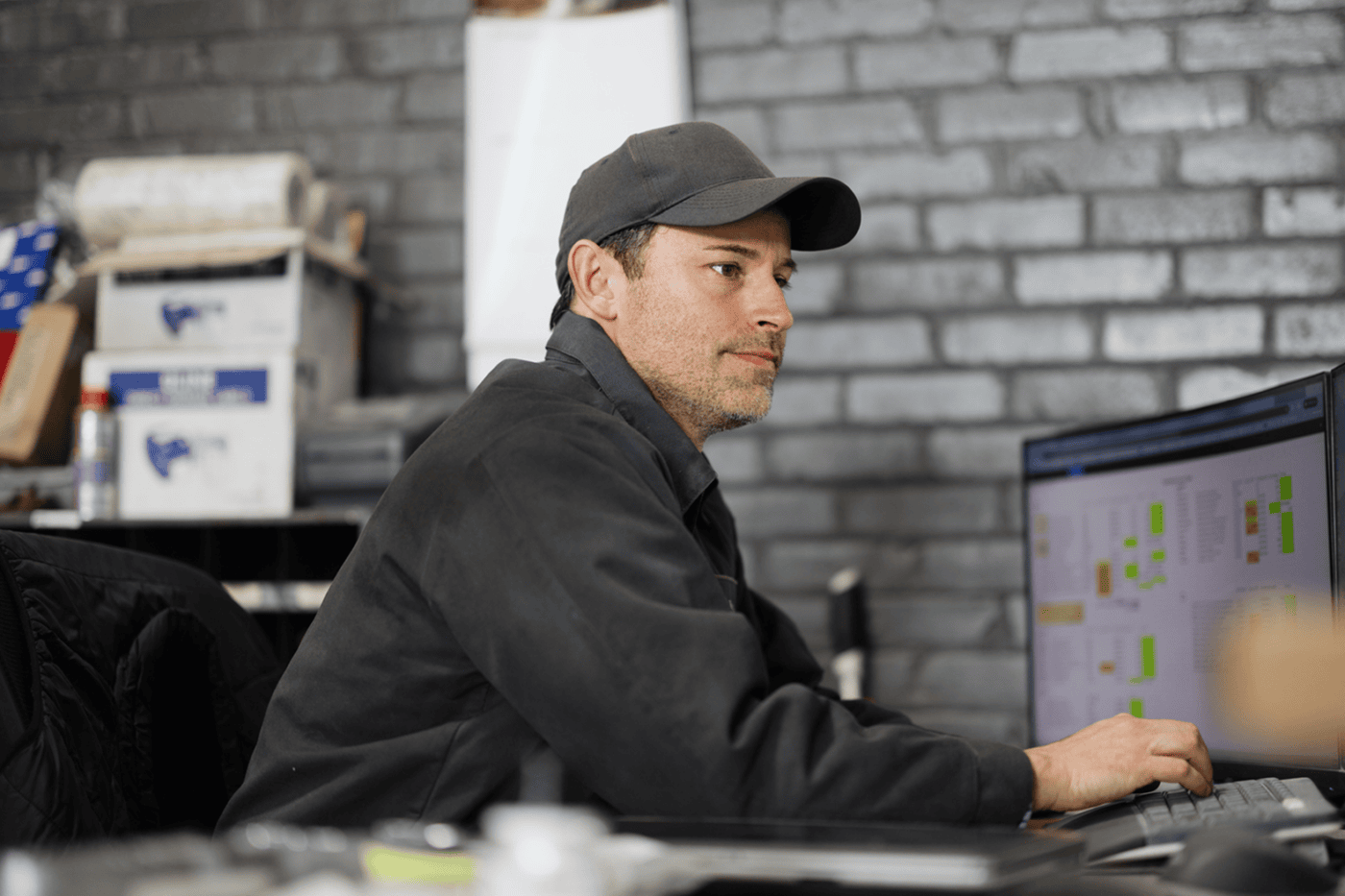 man sits at computer