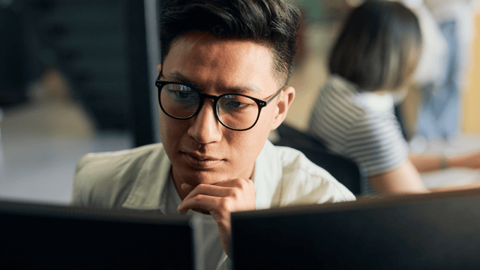 man looking at monitor
