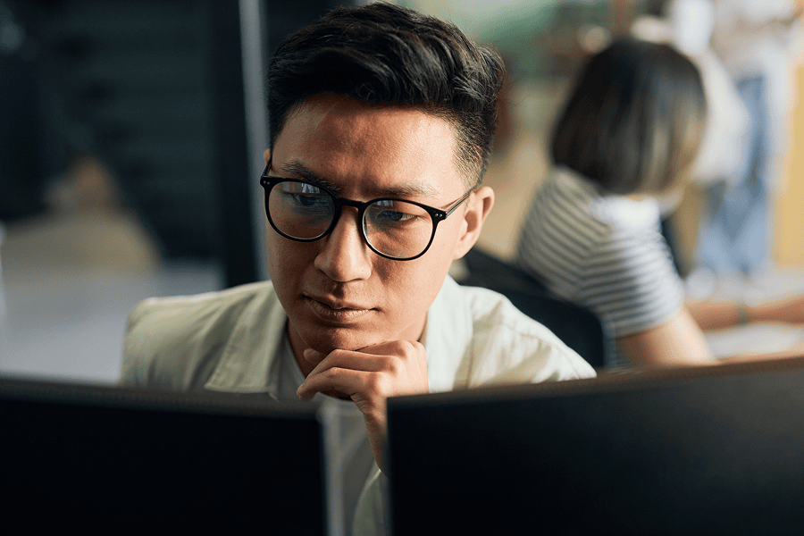 man looking at monitor