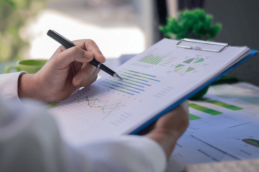 Person analysing graphs and charts.