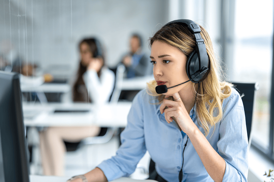 Woman in headset focused on work
