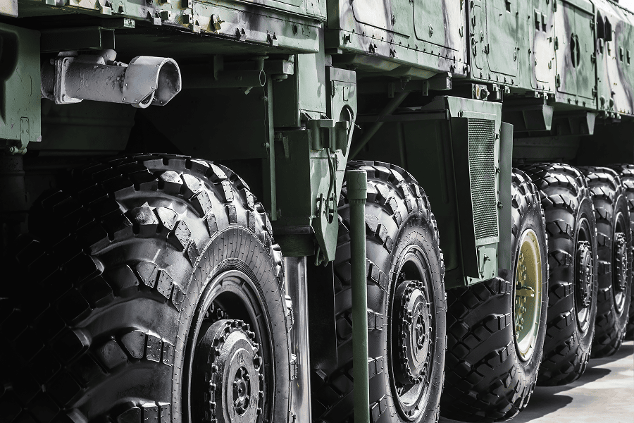 Military vehicle with large, rugged tyres.