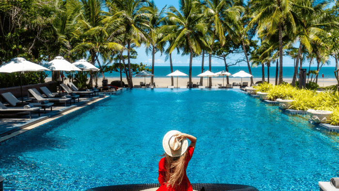 Relaxing by a luxurious poolside oasis.