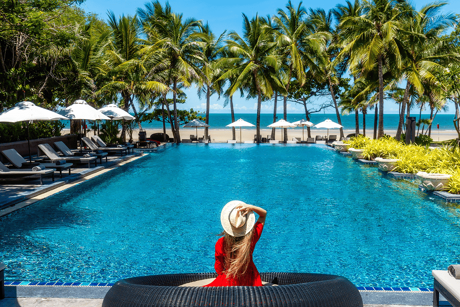 Relaxing by a luxurious poolside oasis.