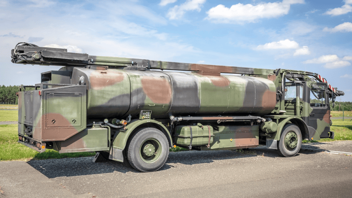 A heavy-duty military tanker truck parked