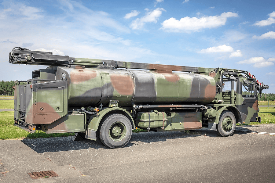 A heavy-duty military tanker truck parked