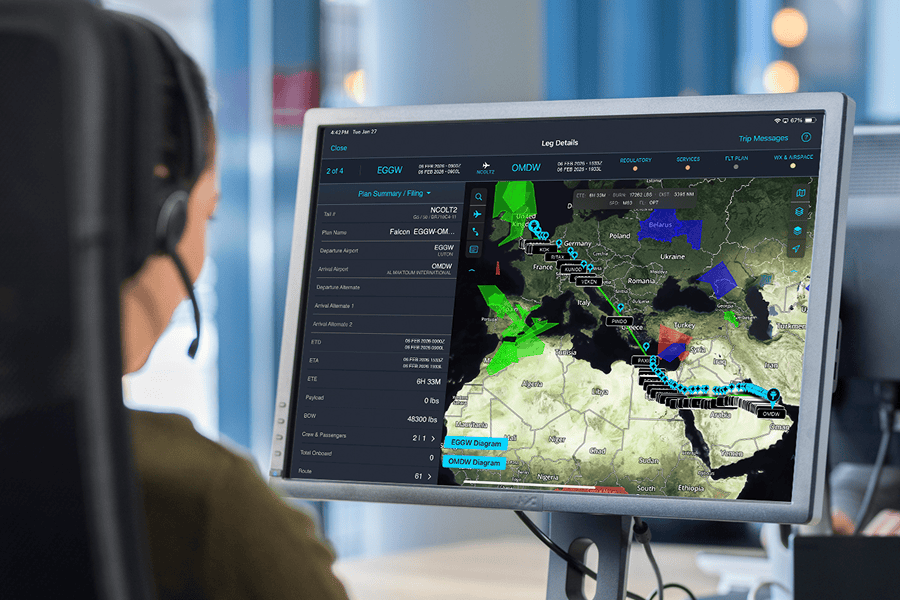 Person monitoring flight route on screen.