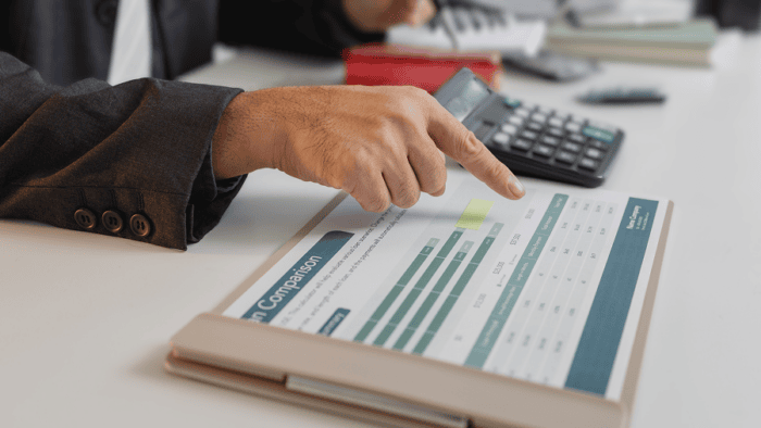 man pointing at report