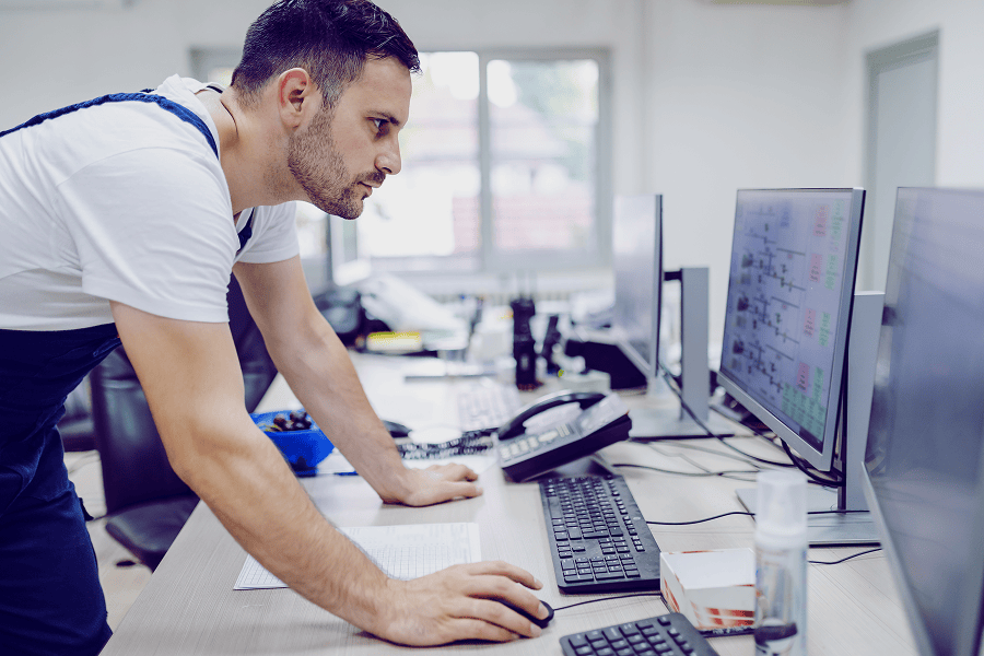 Engineer focused on computer screen.