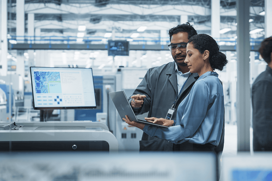 Two technicians engaged in a professional discussion