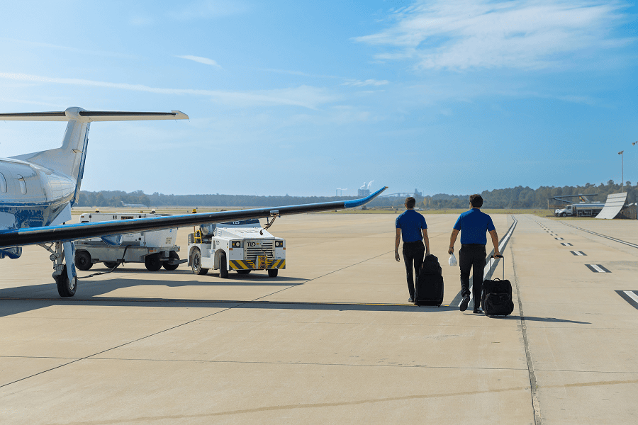 Two men walking with luggage